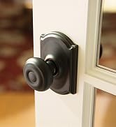 Schlage Georgian Door Knob with Camelot Trim, Hall & Closet Passage Lock in Aged Bronze Finish