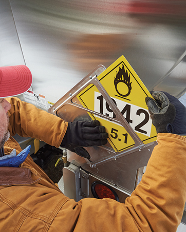 Applying placard to truck