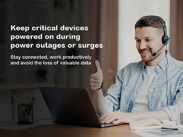 The background shows a workspace setting with a person at their system powered by a back-UPS