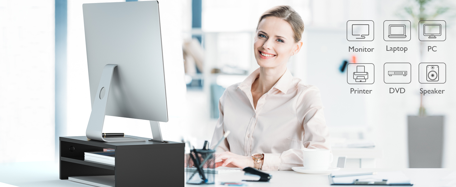 Office desk with computer monitor. Icons indicate features like printer, laptop, and phone connectivity.