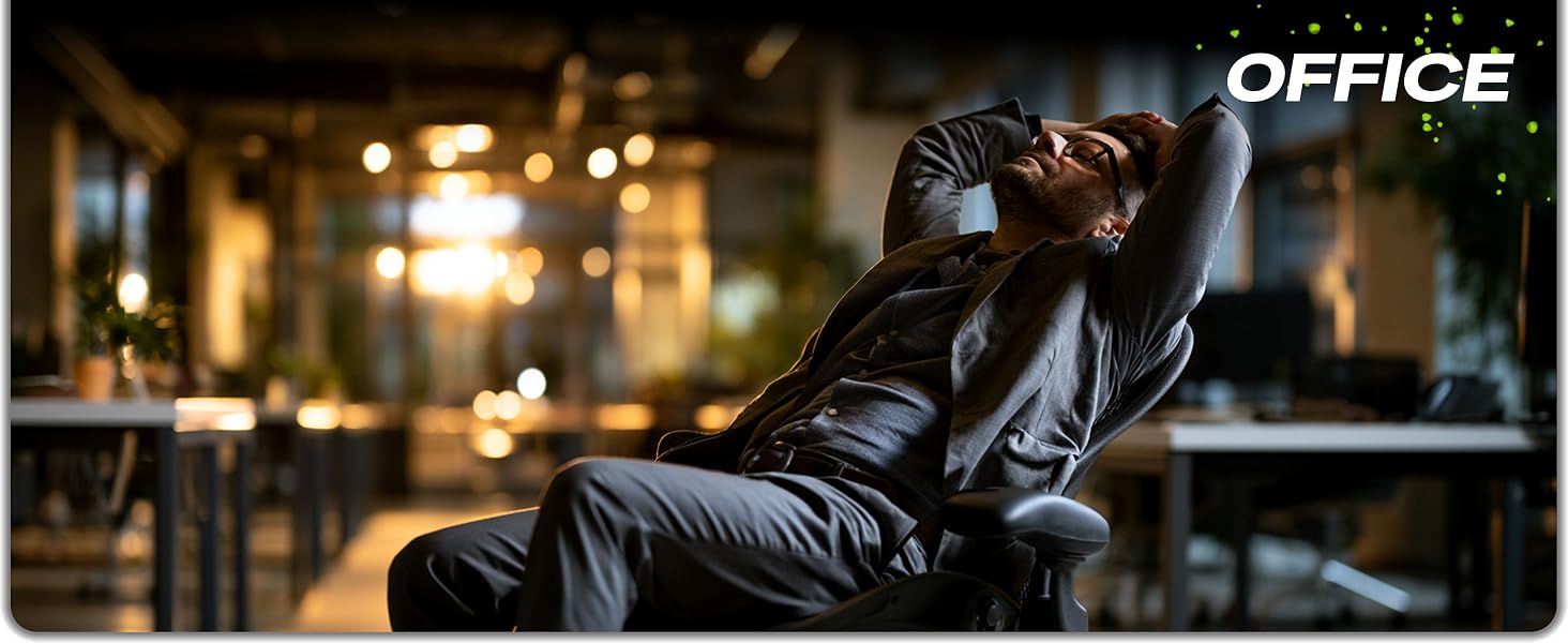 Satisfied man working in an office with an ergonomic mouse pad.