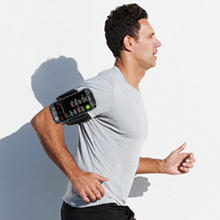 a man wearing a t - shirt with a wristband running on it.