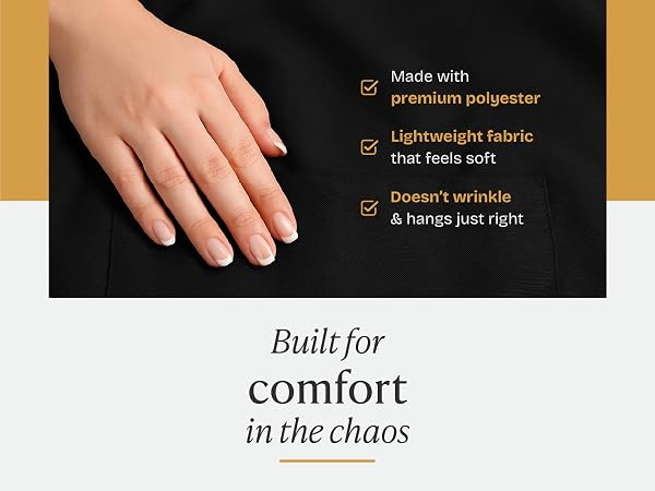 Hand on apron fabric to highlught the high quality fabric.