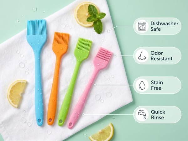 Four wet silicone basting brushes on towel with dishwasher safe and odor resistant icon badges
