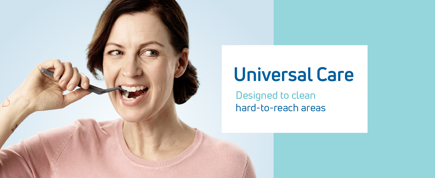 A woman using a small soft toothbrush.