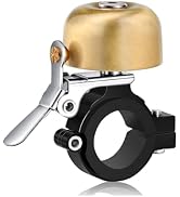 Multiple angles of a gold-colored bell or dome-shaped device with black base component and white lever or handle attachment.