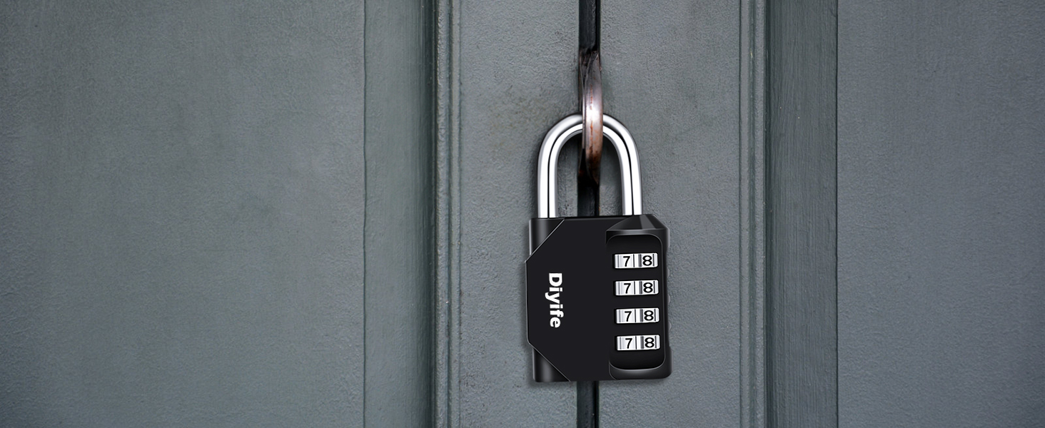 Black combination padlock with four number dials, attached to a metal loop on a gray door or cabinet.
