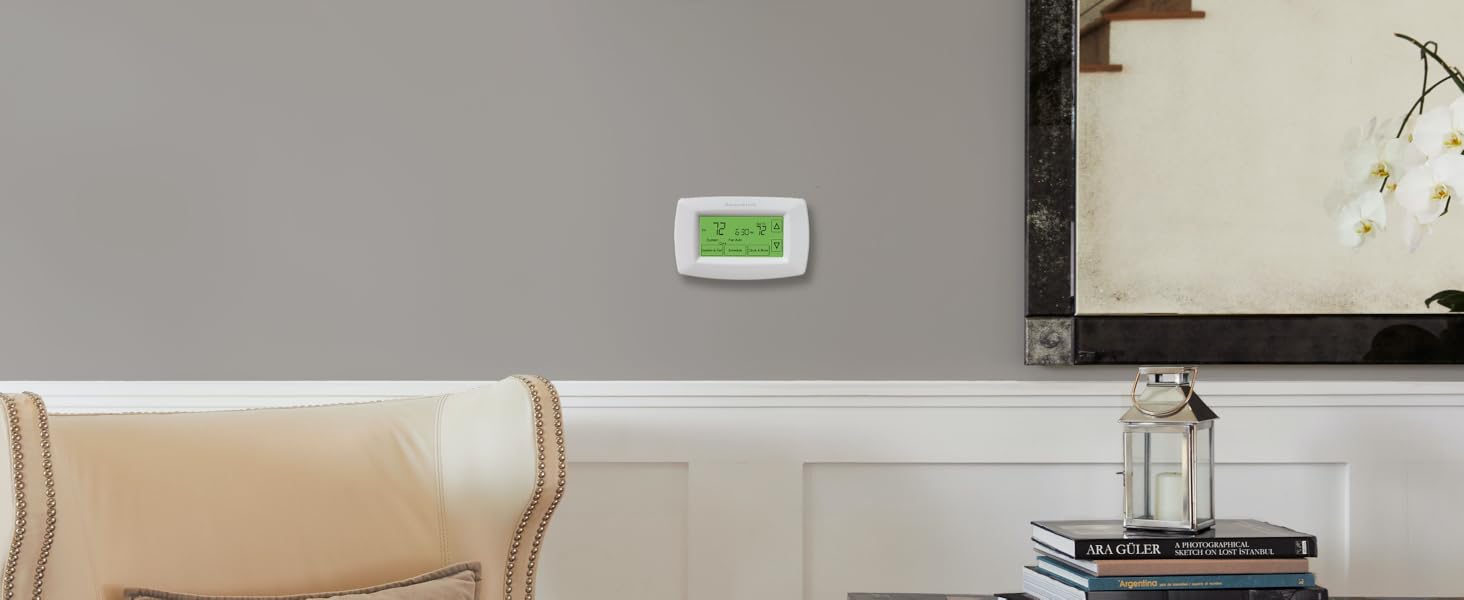 Thermostat installed on wall in a home