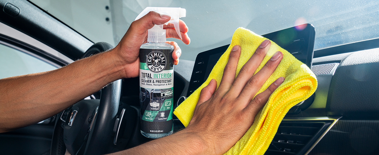 Wiping car leather seats with Total Interior Cleaner microfiber towel