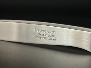 A close-up of the handle of a vegetable peeler