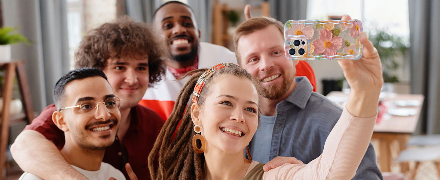 Group taking a selfie photo with smartphone showing floral phone case.