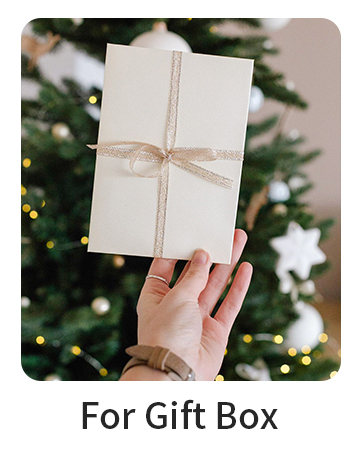 Text reads 'For Gift Box'. White gift box tied with twine string held against blurred Christmas tree background with lights.