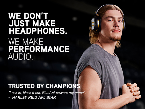 Harley Reid stands in a stadium wearing Pump X headphones, exuding focus and confidence.