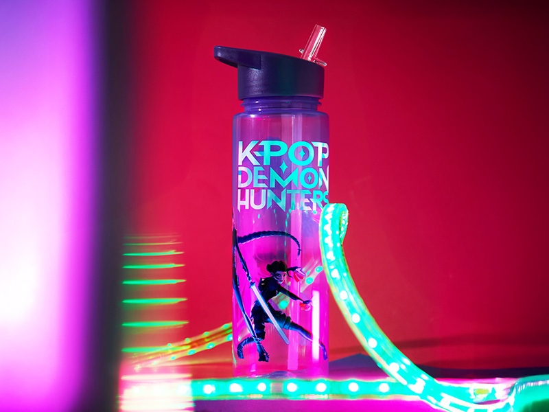 Abstract tech-themed imagery with neon blue and pink lighting effects against dark background, showing geometric patterns and light trails.