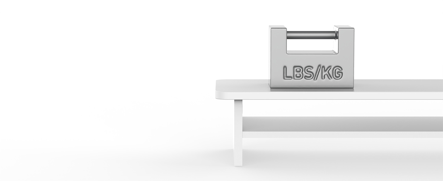 Silver metallic weight with 'LBS/KG' engraved, sitting on a white surface with stepped edges.