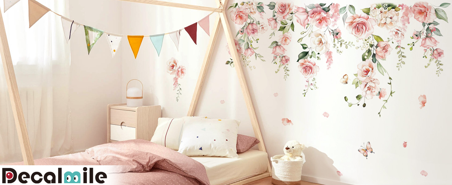 Decorative wall decals featuring pink floral designs and colorful triangular banner. Suitable for children's room or nursery decor.