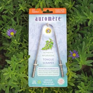 Auromere tongue scraper with cardboard packaging on a natural background