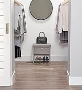 Single Seat Cushioned Bench placed inside walk-in closet under mirror