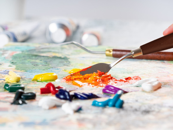 a close up of a paint brush and palette