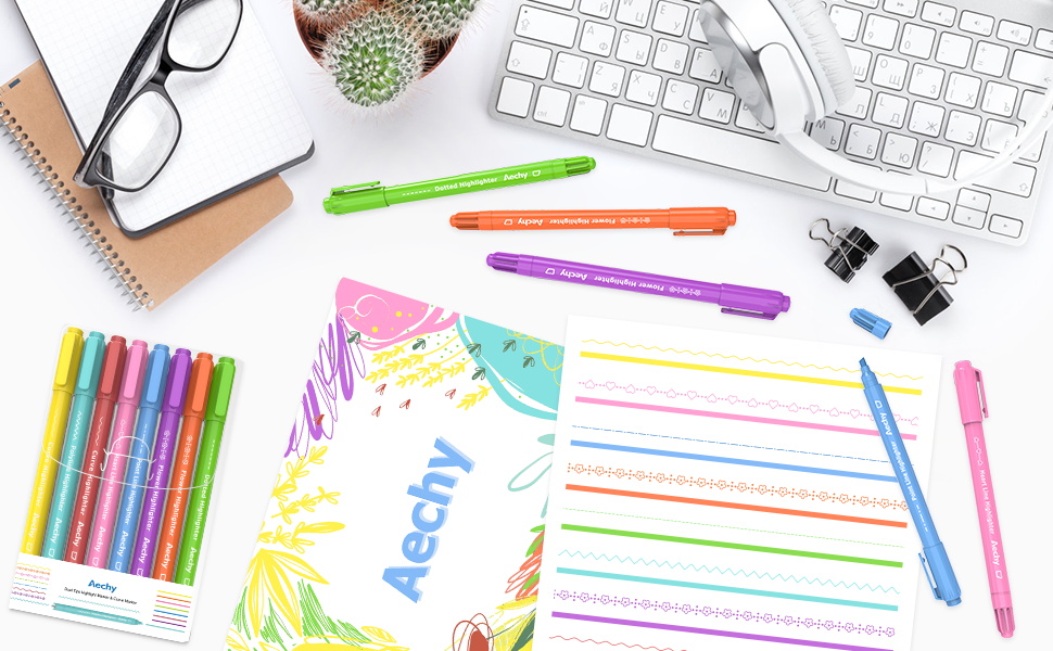 Flat lay of colorful stationery items including highlighters, keyboards, notebooks, and writing tools arranged on white background.