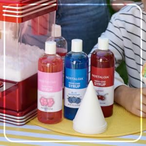 Snow cone syrup sitting on table