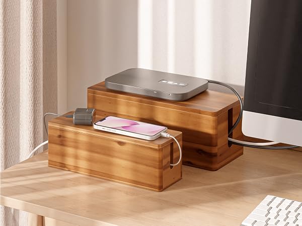 small and large cable box side by side next to computer