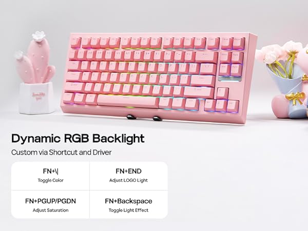 Pink mechanical keyboard with dynamic RGB backlight. Features customizable lighting effects and functions. Displayed with decorative cactus and flower vase accessories.