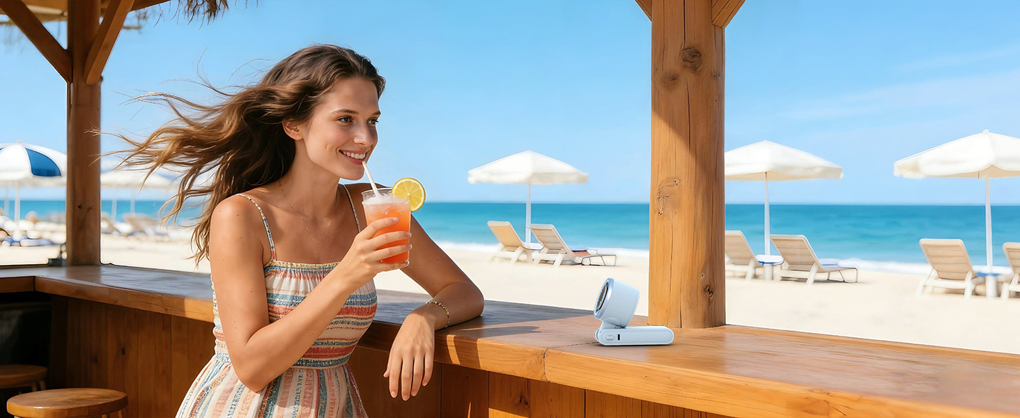 Relaxing vacation essentials blue portable fan on table quiet personal fan for summer beach bar