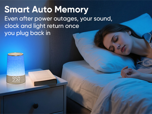 Text reads: 'Smart Auto Memory' and 'Even after power outages your sound, clock and light return once you plug back in'. Blue glowing ambient light device on nightstand next to bed.