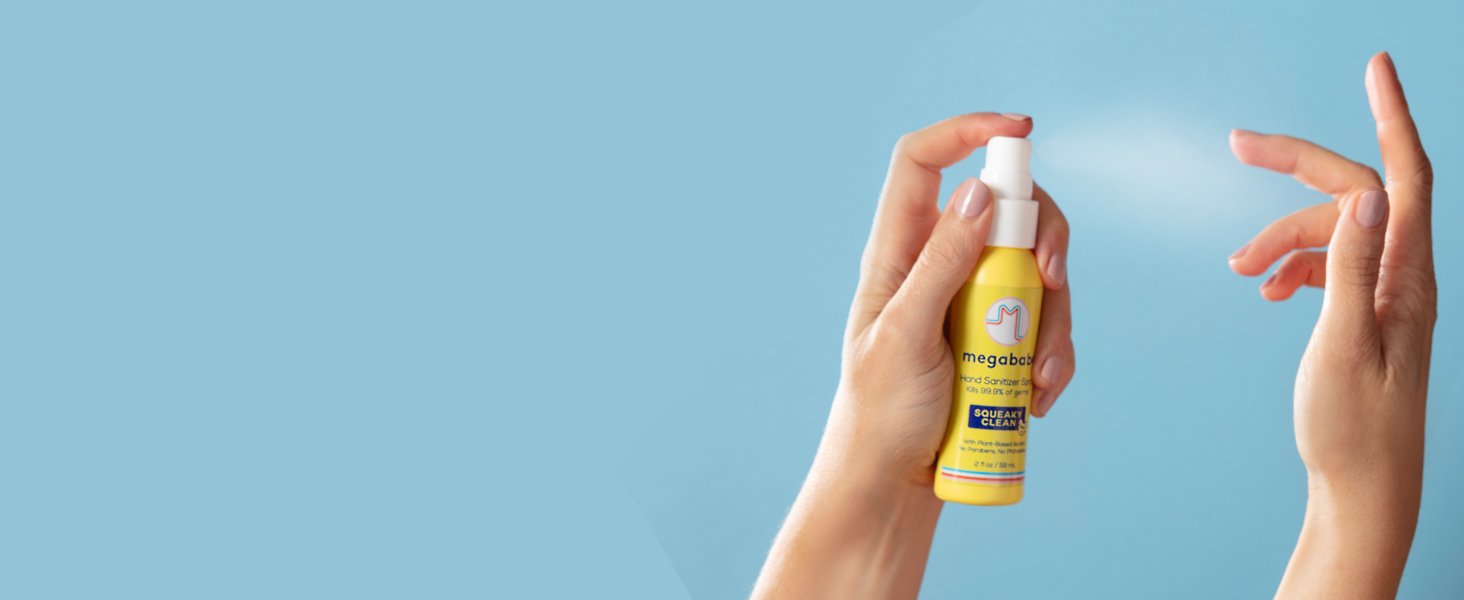 Hand sanitizer spray on blue background.