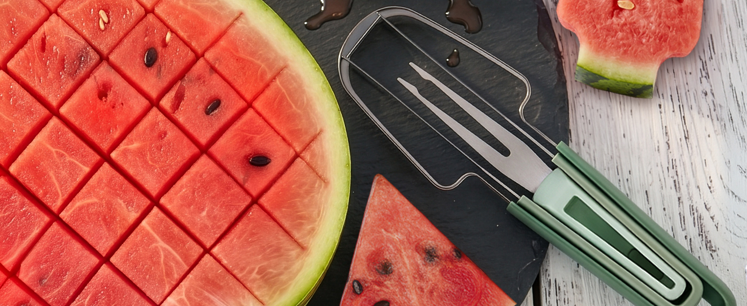 Green-handled water melon cutter tool rests on slate beside a grid-cubed melon half and wedge