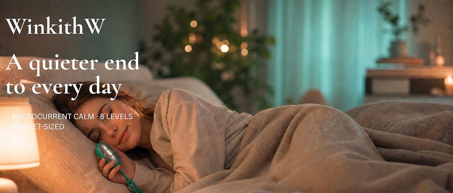 Woman holding WinkithW microcurrent calm device in bed?????