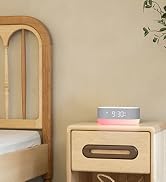 The alarm clock on the nightstand.