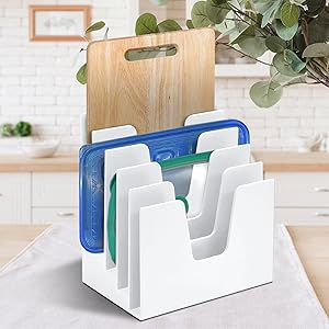 Use your creativity to organize plastic lids, cutting boards and baking sheets over the counter .