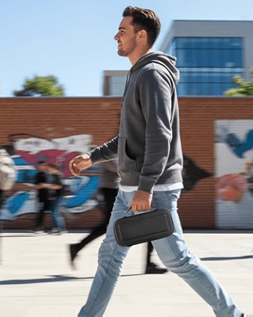 Happy Man walking, carrying Orzly Nintendo Switch 2 case