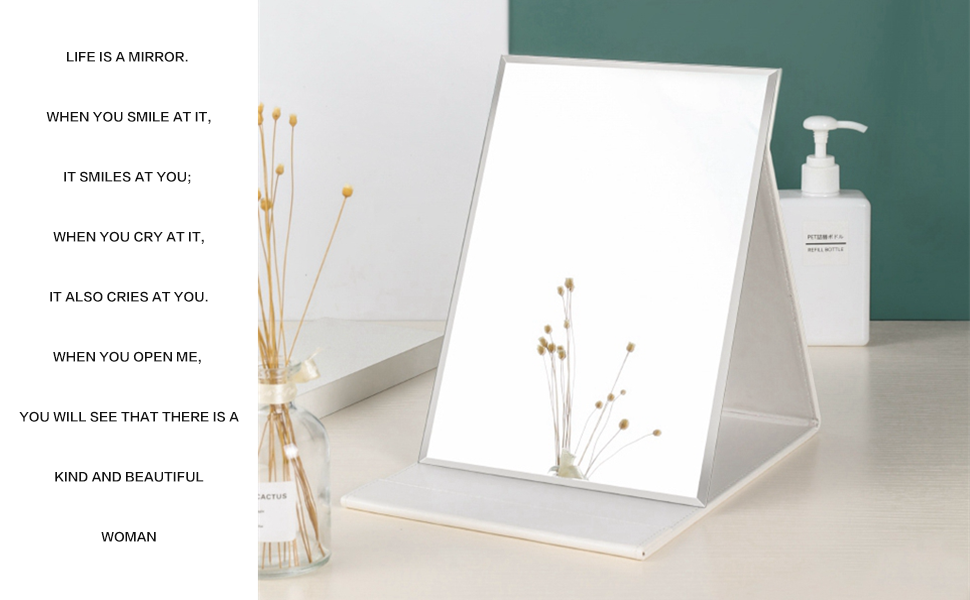 a mirror with a flower on it.