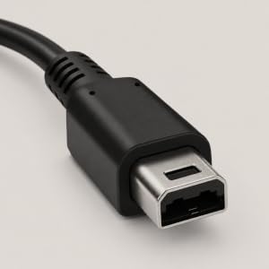 Close-up of a 3DS charging connector plug on a black cable.