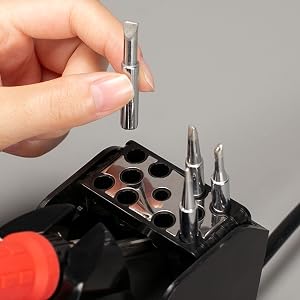 A man is taking out a type-D soldering tip of the YIHUA 926LED-III 110W tip storage