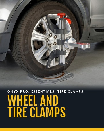 Wheel and tire clamps. ONYX PRO clamp with the gauge on a front wheel on a turn plate