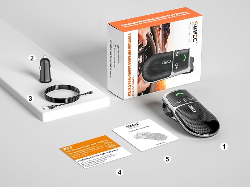 Bluetooth car speakerphone kit with main unit, car charger, USB cable, product box, and instruction manuals. Main unit features textured black surface and green indicator light.