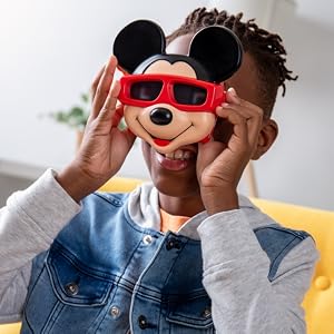 lifestyle boy playing with disney viewfinder