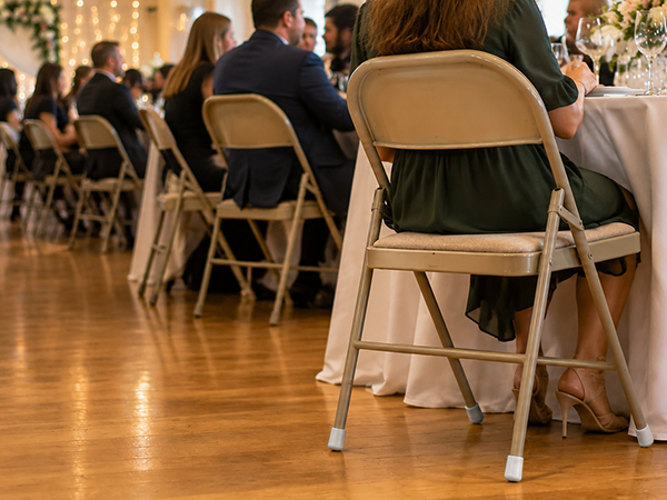 Gluposti - Folding Chair Leg Caps at Wedding Reception