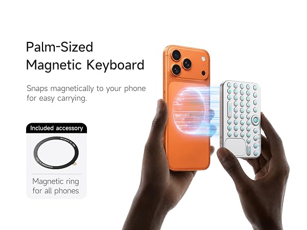Two hands showing mini keyboard magnetically attaching to smartphone