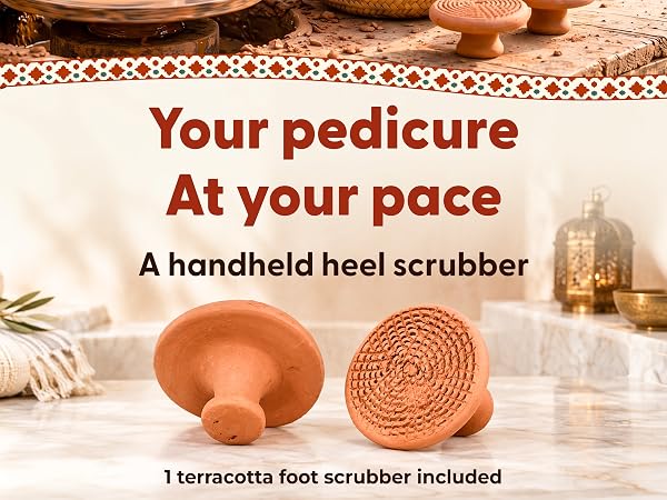 Front and back views of a terracotta heel scrubber on a bathroom counter; one scrubber included