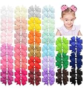 Colorful array of hair bows in various pastel and vibrant shades. Bows feature pinwheel designs and are arranged in vertical columns by color.
