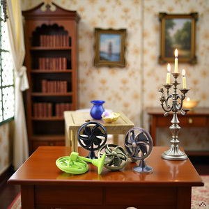A vintage-style desk with a brass table fan and other antique office accessories.