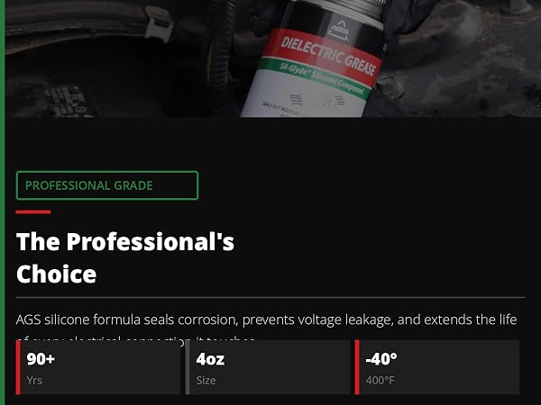Mechanic in black gloves holding AGS Dielectric Grease in engine bay with stat badges