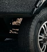 Camco leveling blocks, FasTen ramps, and Big Blocks sitting on the ground in front of an RV