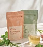 Vianté Peach Lemongrass and Minty Dream loose-leaf teas with a brewed cup