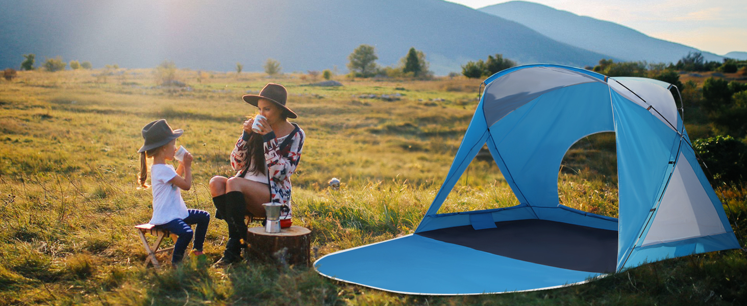 A mother and daughter camping next to a tent